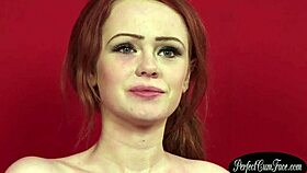 Naughty redheaded beauty enjoys a facial cumshot