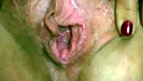 she's fucking her fat wet pussy with a big dildo