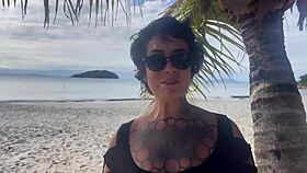 Shibari bondage performed in public with small tits exposed.