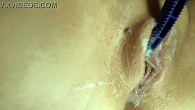 Close-Up Shaving Of Shaved Pussy