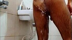 dude gets off in the shower while bathing alone.