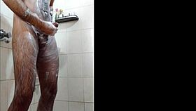 dude gets off in the shower while bathing alone.