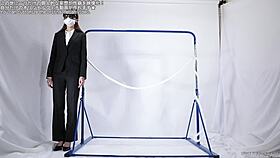 A woman engages in self-pleasure with a rope.