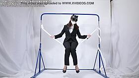 A woman engages in self-pleasure with a rope.