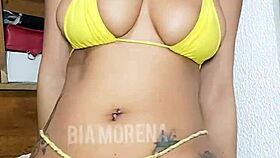 Tattooed Brazilian beauty showing off sensually