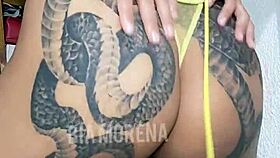 Tattooed Brazilian beauty showing off sensually