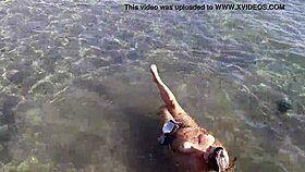 milf teases with candy body on public beach