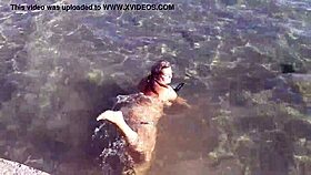 milf teases with candy body on public beach