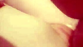 the mature woman is playing with toys and getting spanked