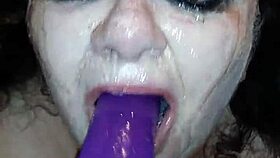 Ms. TL explores deepthroat with toys and dildo, gagging and choking intensely.