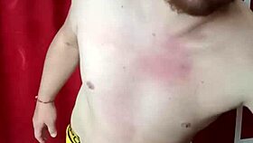 The slave worships his mistress's feet before she tramples and crushes his balls.