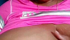 Ebony woman with green eyes and big tits chats casually.