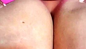 Ebony woman with green eyes and big tits chats casually.