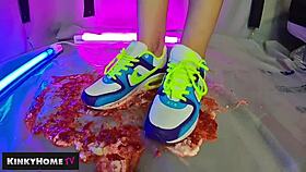 a european amateur crushes food with dirty feet in sneakers