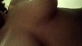 Exploring the juicy ebony pussy's wetness.