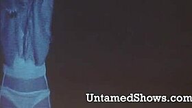 sexy blonde dances striptease on stage with ripped clothes