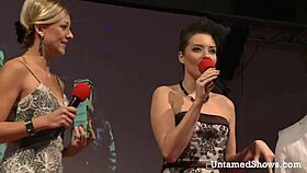 sexy blonde dances striptease on stage with ripped clothes