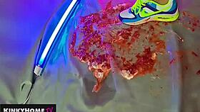 a european amateur crushes food with dirty feet in sneakers