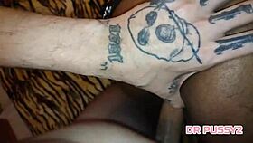 Bent over ebony with big tits and tattoos takes dildo in assfucking