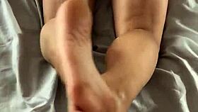 The hot-ass wife gives a reverse footjob from her POV in this amateur fetish video.