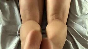 The hot-ass wife gives a reverse footjob from her POV in this amateur fetish video.