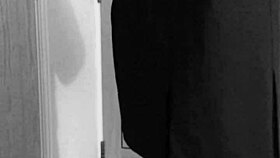 this crossdresser is tying himself up in uniform with handcuffs