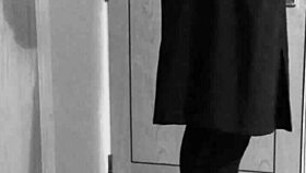 this crossdresser is tying himself up in uniform with handcuffs