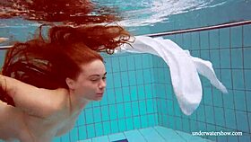 Big tits redhead Lola strips nude underwater in steamy display