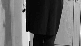 this crossdresser is tying himself up in uniform with handcuffs