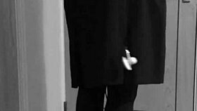 this crossdresser is tying himself up in uniform with handcuffs