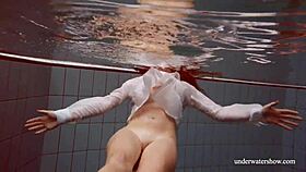 Big tits redhead Lola strips nude underwater in steamy display