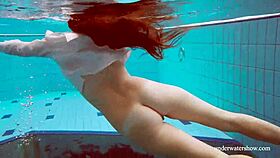 Big tits redhead Lola strips nude underwater in steamy display