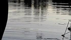 guy pissing in the lake outdoors