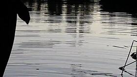 guy pissing in the lake outdoors