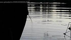 guy pissing in the lake outdoors