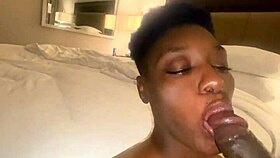 Ebony woman performs oral on large man in homemade setting