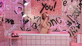 Anita dives into a pink trash bath for raw backstage action. See her in lingerie in the bathroom.