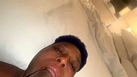 Ebony woman performs oral on large man in homemade setting