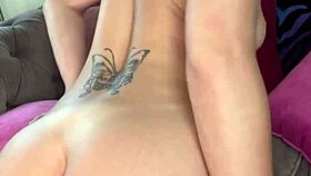 Luna luxe playing with pink vibrator on couch