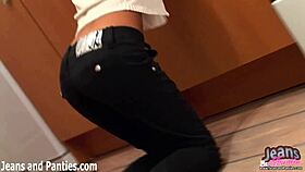 This emo girl with short hair teases in tight blue jeans, clothes ripping off