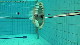 White dressed babe Katy Soroka dives underwater tight