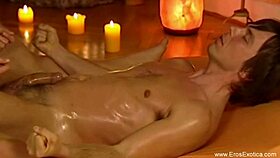 This brunette gives a sensual handjob massage to her tired lover