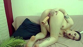 Tattooed teen teases with big dildo in doggystyle