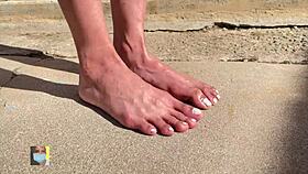 outdoor toe wiggle by sexy model near neighbors