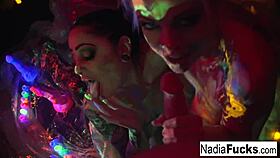 Black-Light Babes Nadia White And Ophelia Suck Off A Colorful Cock?