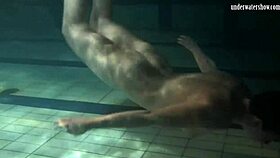 lozhkova shows off in see-through shorts by the pool