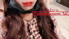 Sexy Chinese shemale Xingzifei shakes cute penis in shiny black stockings outdoors