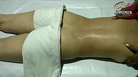 the amateur indian lady receives a full body massage close up at home with homemade techniques.