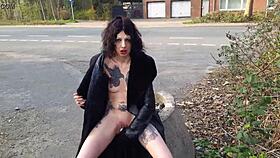 look at this whore pissing and playing with toys on the street