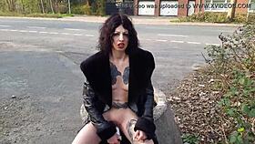 look at this whore pissing and playing with toys on the street